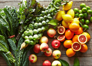 a group of fruits and vegetables on a wood surface Healthy Weight Loss Diets Windlesham