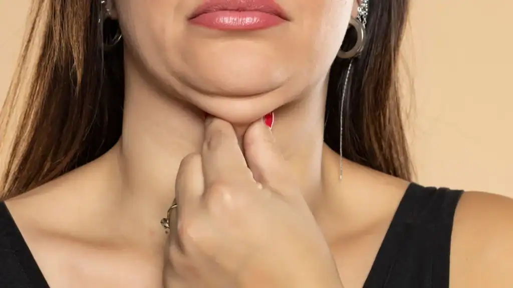 An image of a woman with double chin, sad, worried : Non Surgical Double Chin Removal Treatment in Windlesham, UK